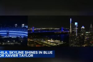 Philly skyline, sports complex lights up in blue for injured NJ baseball player