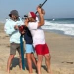 Fisherman reels in white shark off Massachusetts, then snags the hook from its toothy mouth