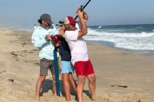 Fisherman reels in white shark off Massachusetts, then snags the hook from its toothy mouth