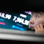 Asian shares fall after a tech sell-off on Wall Street, while oil prices gain