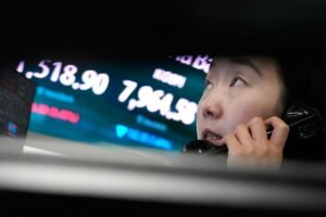 Asian shares fall after a tech sell-off on Wall Street, while oil prices gain