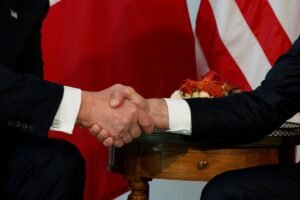 From white knuckles to open barbs, Trump and Macron bring a rocky history to the G7 summit