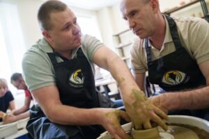 A blind Ukrainian veteran turns pottery into a business and mentors others