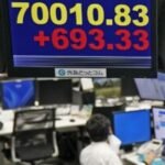 Bank of Japan raises its key interest rate to a three-decade high of 1%, citing inflation