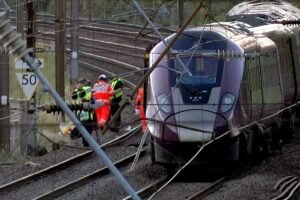 UK police probe cause of train collision that killed driver and left 9 in critical condition