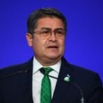 Former President Juan Orlando Hernández returns to Honduras after arrest warrant suspended