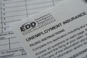 US filings for jobless benefits rise to 197,000 last week, but layoffs remain historically low