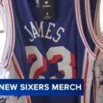 Fans line up for chance to buy LeBron James 76ers jerseys at special team store opening