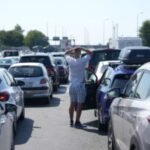 Hourslong waits at Croatia-Serbia border test travelers' resolve in sweltering heat