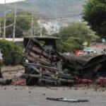 Truck explodes outside Colombia police base, injuring 11 officers and killing a dog